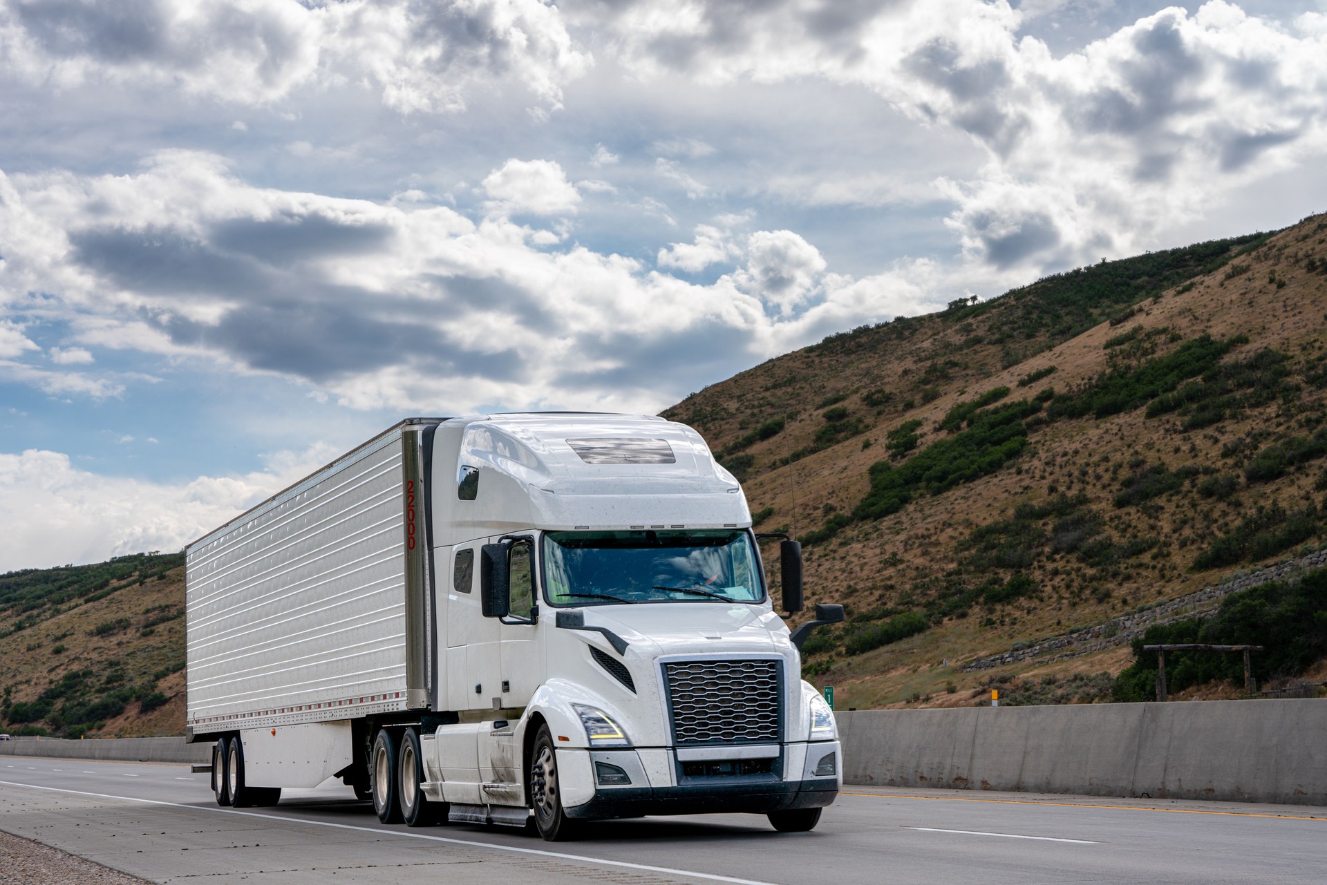 White Semi Truck on A Two Lane Highway